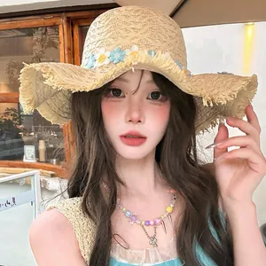 Wide brim straw sun hat with floral decoration for beach vacation sun protection
