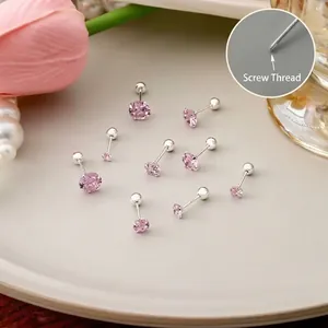 Close-up detail of 925 silver stud earrings with internal screw thread and pink zircon