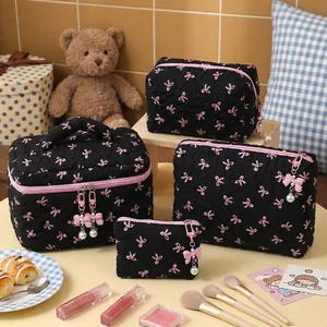 Cute black quilted makeup bag set with pink bow pattern and pearl zipper charms