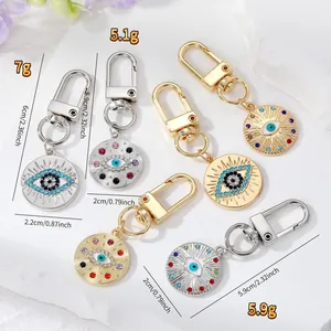 Detailed product view of Evil Eye keychains with precise weight and size dimensions