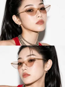 High-fashion detail of rimless cat-eye sunglasses with vintage pink transparent lenses