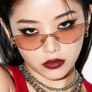Stylish vintage rimless cat-eye sunglasses with gradient pink lenses on Asian model