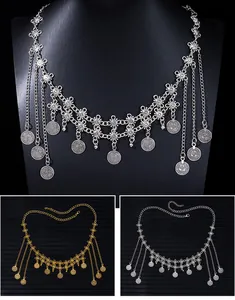 Detailed view of Bohemian vintage metal coin tassel waist chain in silver and gold colors