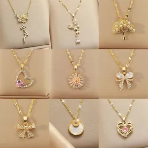 Assorted gold-toned stainless steel necklaces with elegant butterfly and heart pendants