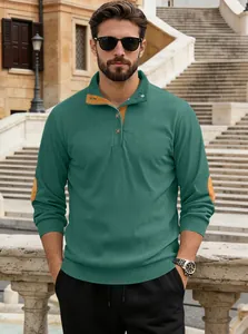 Macro view of men's emerald green corduroy henley sweater with brown elbow patches
