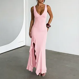 Detail showing the ruffled high side slit on an elegant pink deep V-neck sleeveless maxi dress