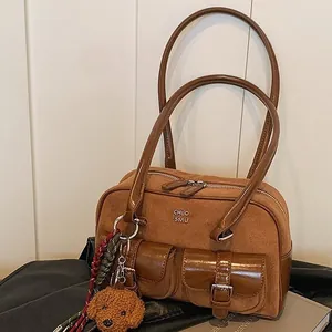 Vintage brown faux suede bowling bag with front pockets and cute teddy bear charm