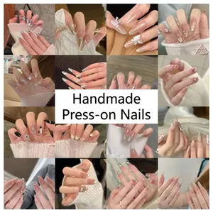Collection of handmade press-on nails in various elegant and minimalist designs