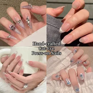 Collection of wearable press-on nails in cat-eye, French, and butterfly designs