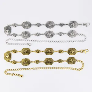 Detailed view of Bohemian vintage metal waist chains in silver and antique gold finishes.
