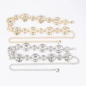 Detail view of gold and silver metallic waist chains with textured round discs for women