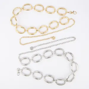 Elegant gold and silver metal waist chain belts with textured oval links and flower charms.