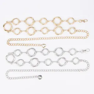 Detailed view showing decorative gold and silver metal ring waist chains for women's dresses