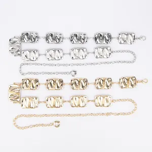 Detailed view of bohemian style metal waist chains in gold and silver finishes