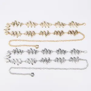 Detailed view of metal waist chains in gold and silver with stylish zigzag link design