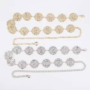 Detail view of gold and silver bohemian metal waist chain belts for women