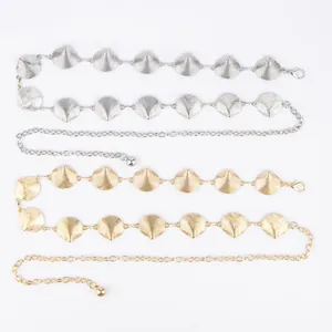 Detailed view of vintage bohemian metal leaf-shaped waist chains in gold and silver finishes