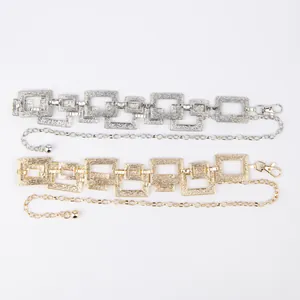 Detailed view of gold and silver textured rectangular link waist chains for dresses