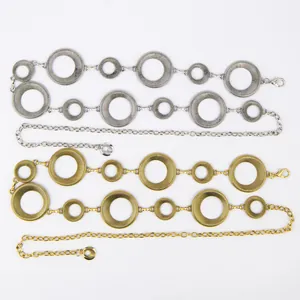 Detailed view of gold and silver textured ring waist chains in a vintage Bohemian style