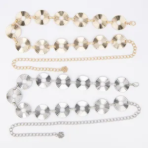 Detail view of premium gold and silver metal waist chains with sunburst disc designs