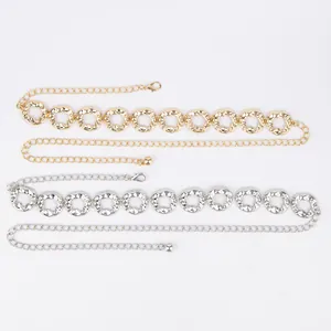 Detailed view of elegant gold and silver metal waist chains for dresses and pants.