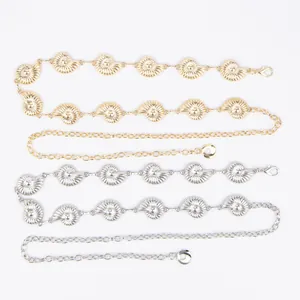 Detail of vintage bohemian metal shell waist chains in gold and silver options