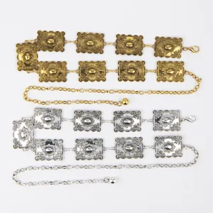 Detailed macro view of bohemian style metal waist chains in gold and silver finishes