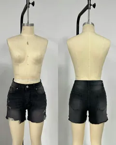 Detailed front and back view of high-waisted black distressed denim shorts for women.