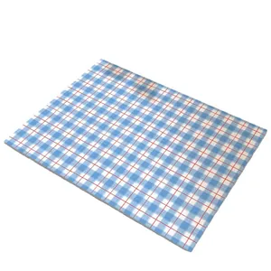 Absorbent kitchen countertop mat with blue and white checkered pattern and red grid