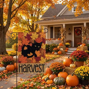 Detail of Thanksgiving garden flag with black cat and harvest theme in autumn yard.