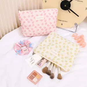 Floral mesh cosmetic storage bags in pink and cream with pastoral summer patterns