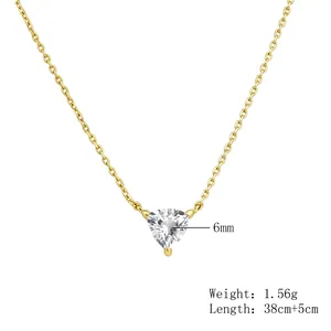 Close-up of an s925 sterling silver gold necklace featuring a triangular zircon pendant
