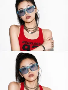 Close-up detail of stylish large blue square sunglasses worn by an Asian model