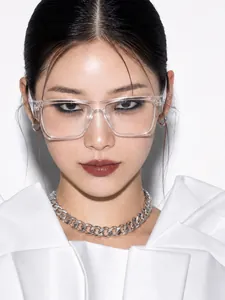 Close-up of Asian female model wearing trendy clear transparent square frame glasses.