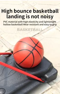 Detail view of a lightweight red hollow PVC basketball on a sturdy black sport base