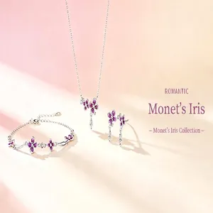Detailed view of the purple iris flower necklace, earrings, and bracelet jewelry set.