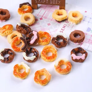 Detailed macro view of various colorful miniature donuts for dollhouse DIY craft accessories