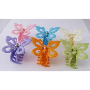 Detail view showing a set of six colorful butterfly-shaped plastic hair claw clips for girls.