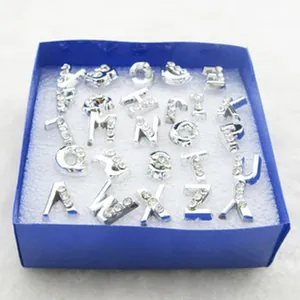 Silver alloy alphabet letter charms with clear crystal accents in a blue gift box