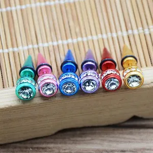 Detailed view of colorful spike stud earrings with sparkling clear crystal accents