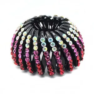 Macro detail of bird's nest expanding hair clip decorated with sparkling gradient rhinestones