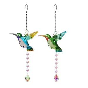 Set of two colorful hummingbird crystal suncatchers with prism pendants for garden decor.