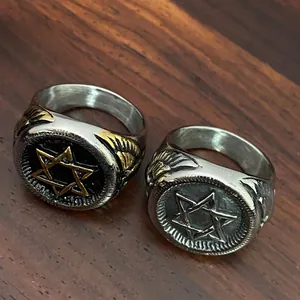 Detailed view of stainless steel military rings with Star of David and eagle wing motifs