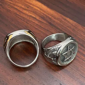 Close-up of vintage stainless steel military ring with hexagram star and eagle relief