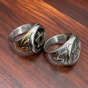 Close-up detail of vintage stainless steel military rings with hexagram and eagle motifs