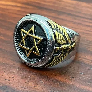 Close-up of vintage stainless steel military ring with golden hexagram and eagle details