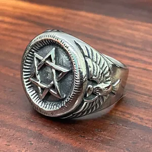 Close-up detail of vintage stainless steel military ring with hexagram and eagle head