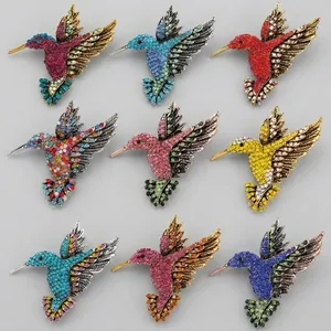 Set of colorful rhinestone hummingbird brooches in various vintage alloy finishes