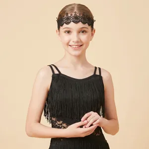 Close-up detail of a black hollow lace headband for Latin dance worn by a young girl.