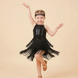 Close-up detail of a black lace embroidered floral headband worn by a child dancer